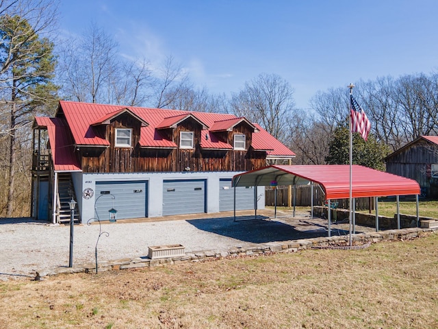 exterior space featuring a garage and gravel driveway