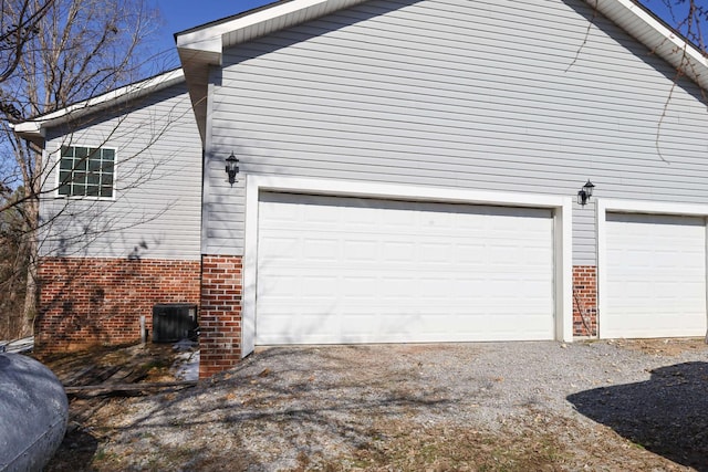 1335 Bumpus Mills Rd, Dover, TN 37058 - view of home's exterior with brick siding, driveway, and a garage