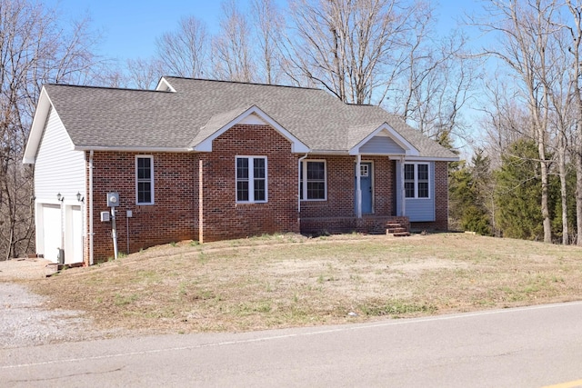1335 Bumpus Mills Rd, Dover, TN 37058 - ranch-style house featuring brick siding, an attached garage, a front yard, and roof with shingles