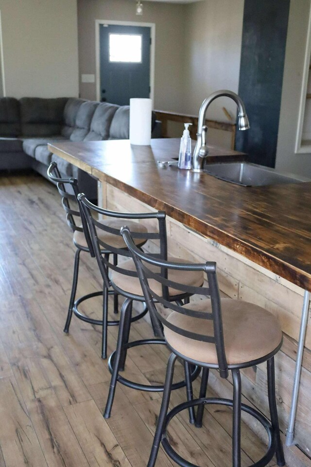 1335 Bumpus Mills Rd, Dover, TN 37058 - bar with wood finished floors and a sink