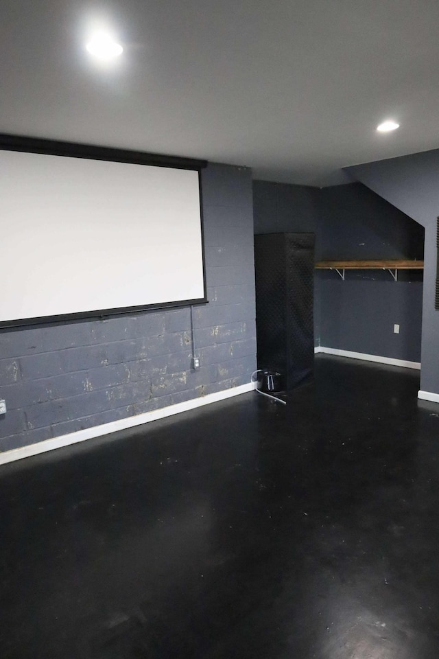 1335 Bumpus Mills Rd, Dover, TN 37058 - home theater room featuring concrete block wall, finished concrete flooring, and recessed lighting