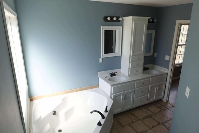 1335 Bumpus Mills Rd, Dover, TN 37058 - full bathroom with a sink, stone finish flooring, a bath, and double vanity
