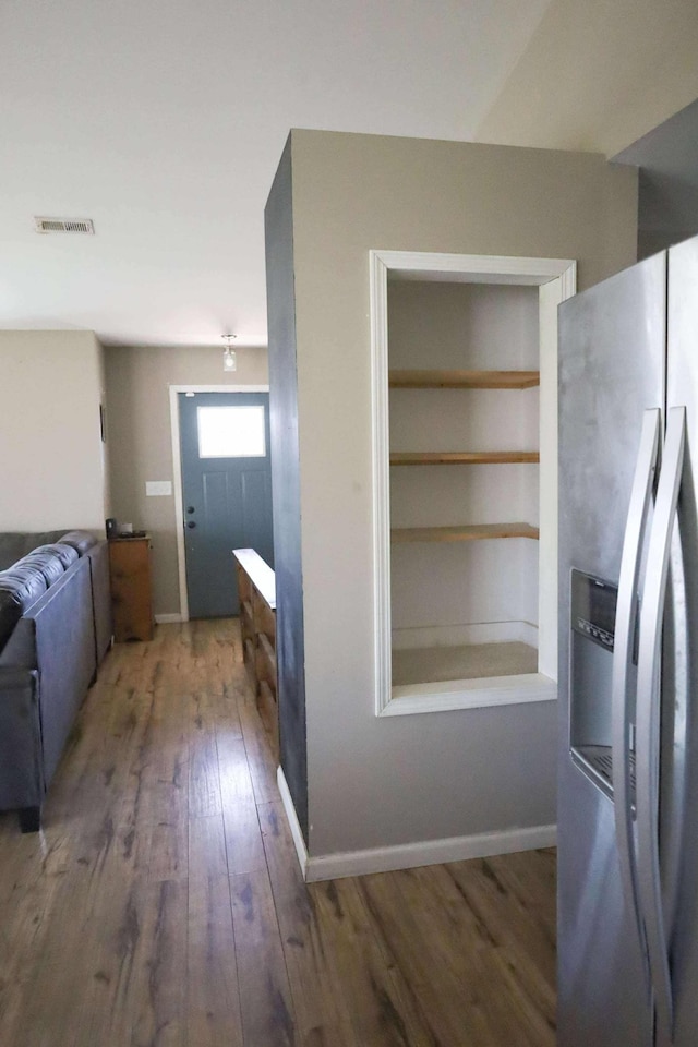 1335 Bumpus Mills Rd, Dover, TN 37058 - kitchen featuring wood finished floors, visible vents, stainless steel fridge, and baseboards