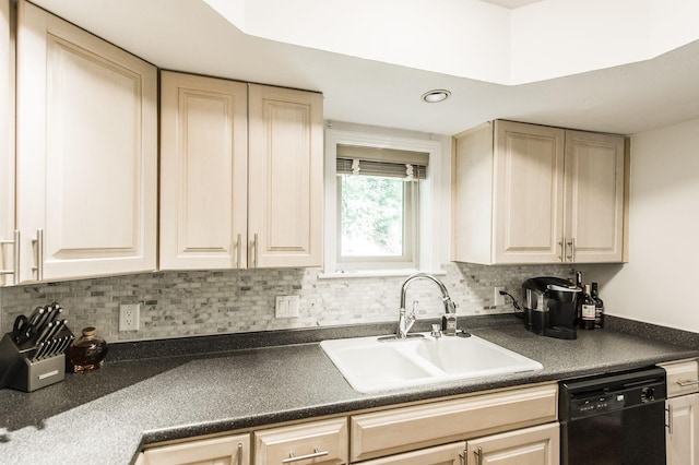 kitchen featuring a sink, dark countertops, dishwasher, and light brown cabinetry