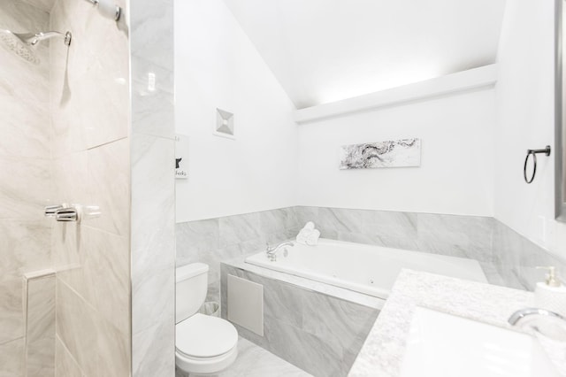 bathroom featuring tile walls, lofted ceiling, toilet, a sink, and a bath