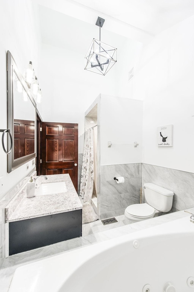 bathroom with visible vents, toilet, curtained shower, vanity, and a notable chandelier