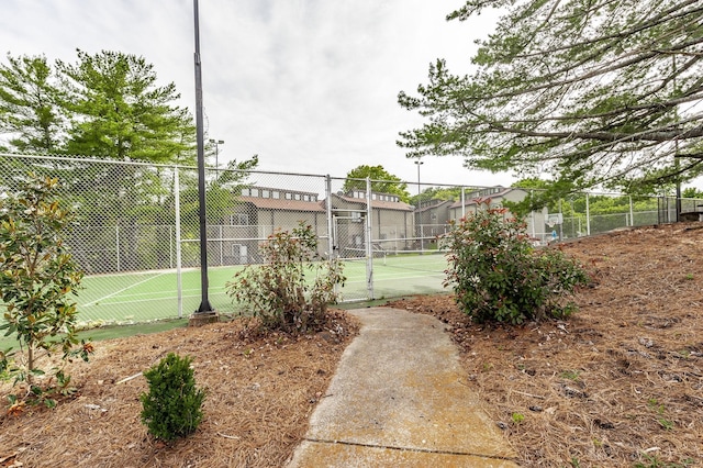 view of sport court with fence