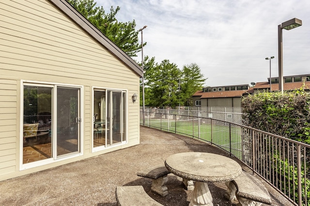 view of patio / terrace featuring fence