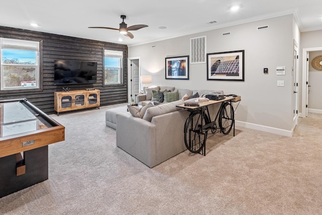 living room featuring light carpet, visible vents, baseboards, crown molding, and recessed lighting