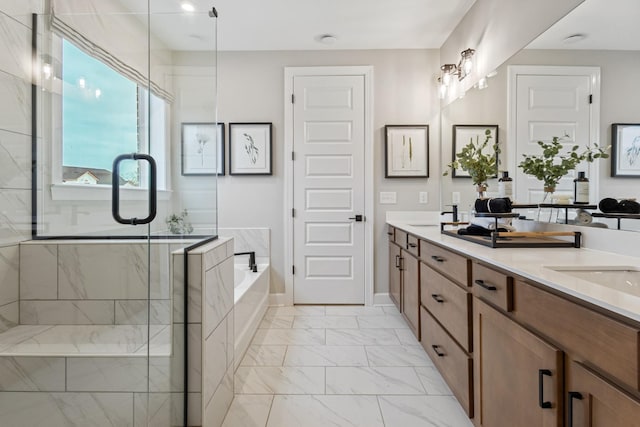 full bathroom featuring a sink, marble finish floor, a bath, double vanity, and a stall shower