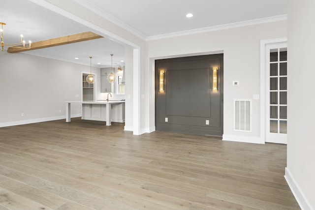 interior space with recessed lighting, visible vents, baseboards, light wood finished floors, and crown molding