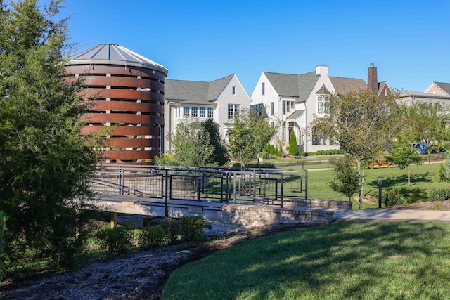 view of property's community featuring a yard