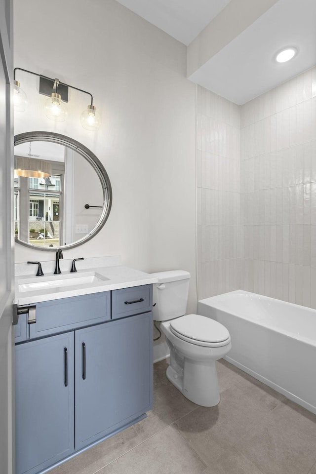 full bath with bathtub / shower combination, vanity, toilet, and tile patterned floors