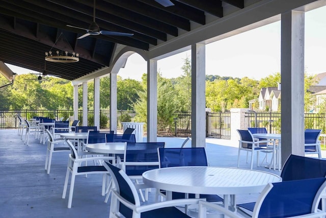 view of patio / terrace featuring fence, a ceiling fan, and outdoor dining space