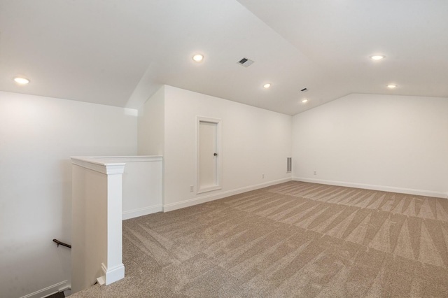 bonus room featuring recessed lighting, light colored carpet, visible vents, vaulted ceiling, and baseboards