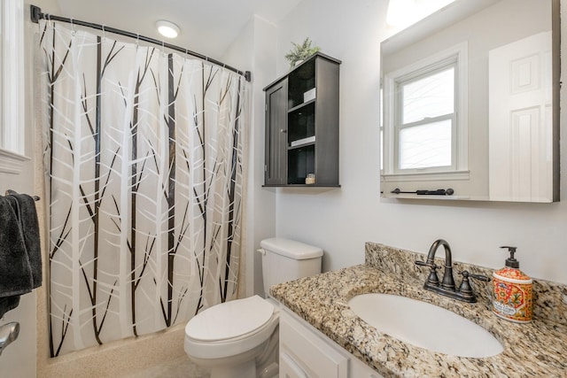 full bathroom with toilet, curtained shower, and vanity