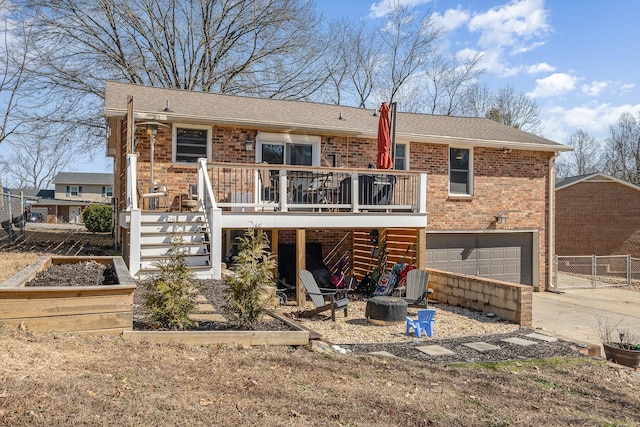 view of front of house with driveway, a vegetable garden, stairway, an attached garage, and brick siding