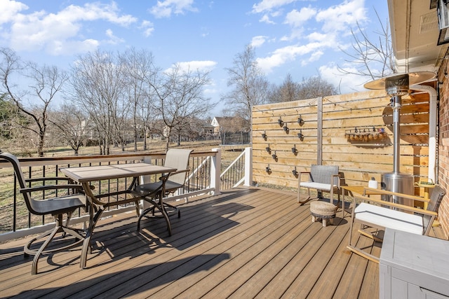 deck with outdoor dining area