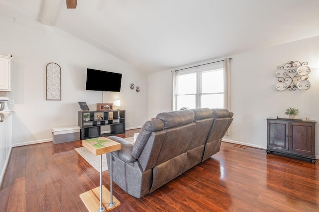 living area featuring lofted ceiling with beams, dark wood-style floors, and baseboards