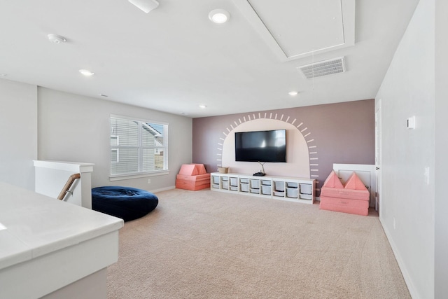 game room with attic access, visible vents, carpet floors, and baseboards