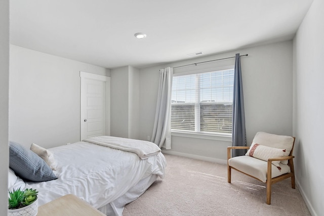 bedroom featuring carpet, visible vents, and baseboards