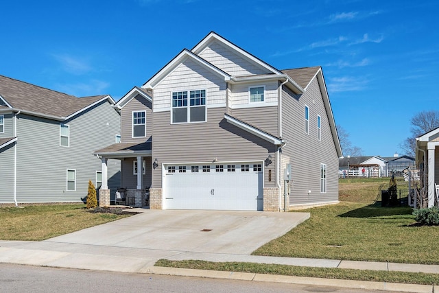 view of front of property featuring driveway, a front lawn, and an attached garage