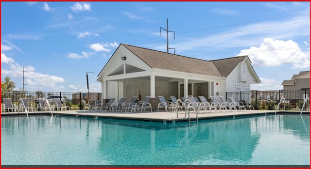 pool featuring a patio area and fence