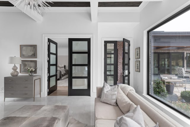 bedroom featuring french doors and beamed ceiling