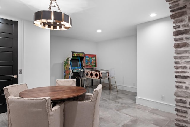 dining room with recessed lighting and baseboards