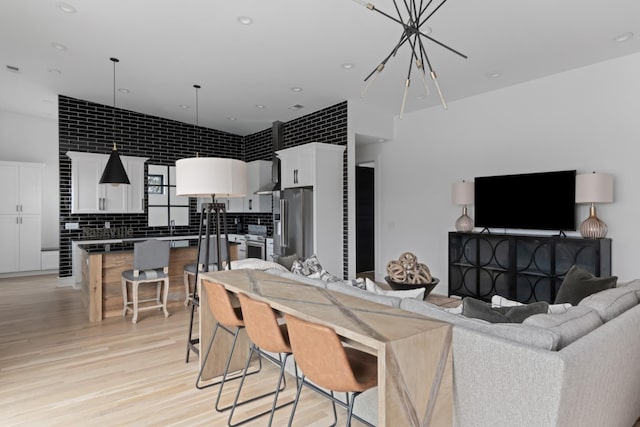 living room featuring recessed lighting and light wood-style flooring