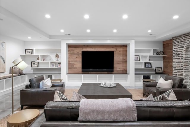 living room with built in shelves, recessed lighting, and visible vents