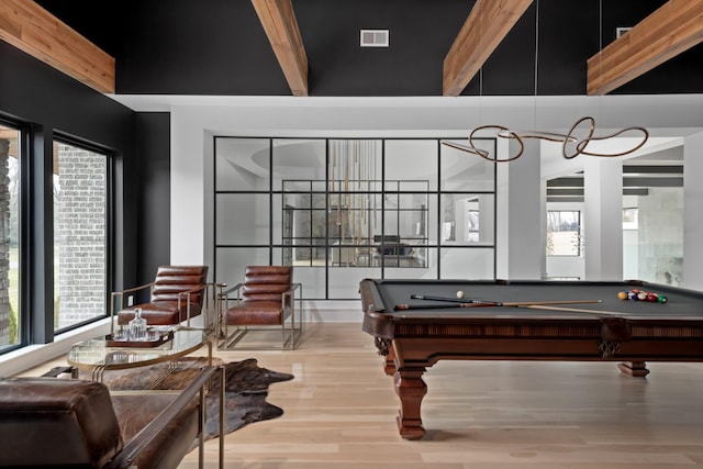 game room featuring light wood-type flooring, a healthy amount of sunlight, visible vents, and pool table