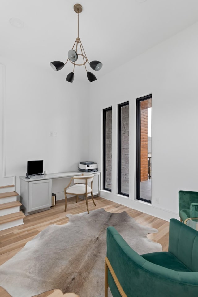 sitting room featuring light wood-style floors and baseboards