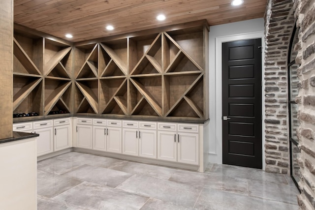 wine area featuring wood ceiling and recessed lighting