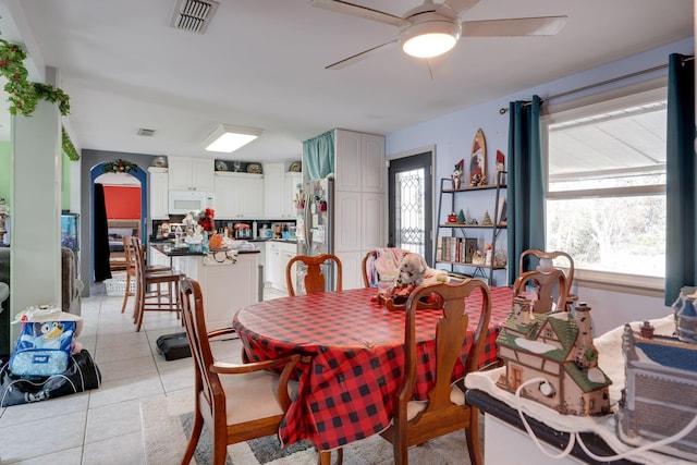 dining room with visible vents, ceiling fan, and light tile patterned floors