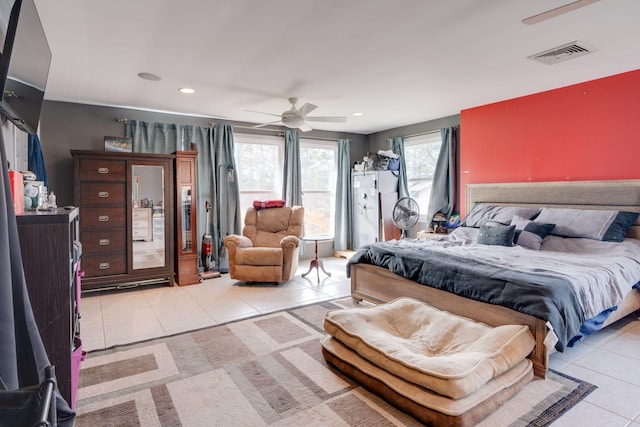 bedroom with light tile patterned floors, a ceiling fan, visible vents, and recessed lighting