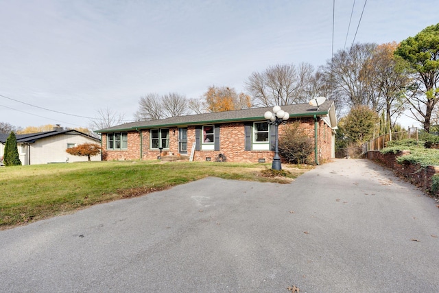 ranch-style house featuring crawl space, a front lawn, and brick siding