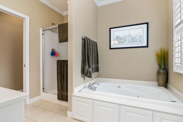 full bath with a garden tub, tile patterned flooring, crown molding, and a stall shower