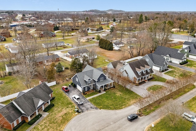 birds eye view of property with a residential view