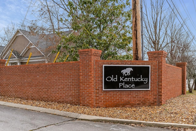 community sign with fence