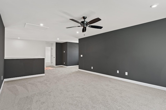 unfurnished room with recessed lighting, light carpet, a ceiling fan, baseboards, and attic access