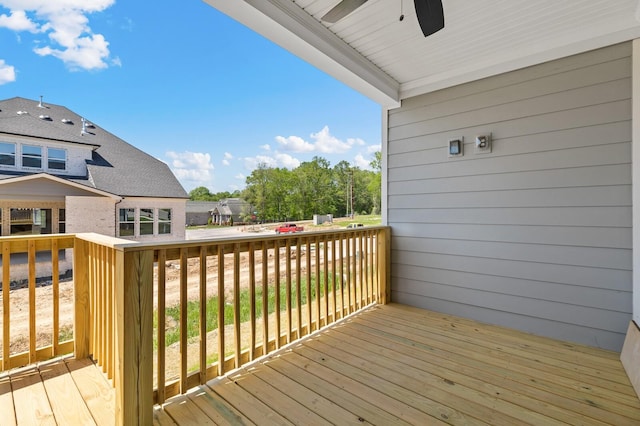 deck featuring ceiling fan and a residential view