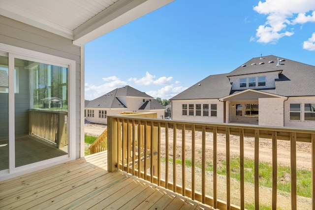 wooden deck with a residential view