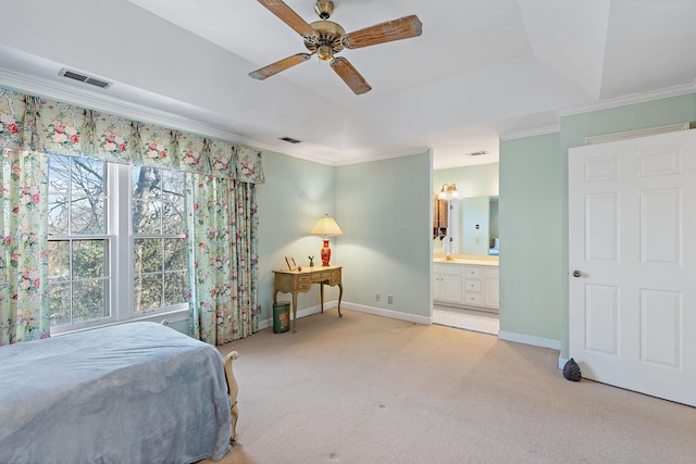 bedroom with baseboards, visible vents, a raised ceiling, light colored carpet, and ornamental molding