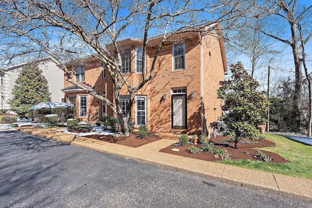 view of front facade featuring brick siding