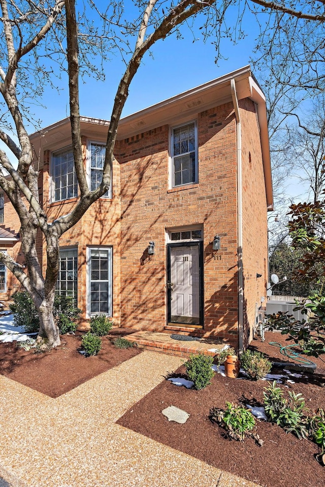 view of front of home featuring brick siding