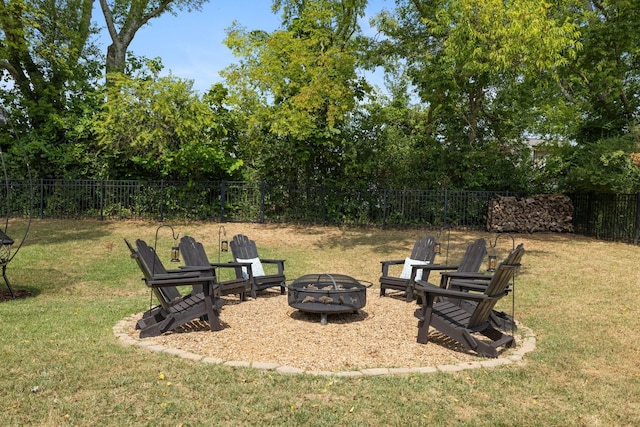 view of yard featuring an outdoor fire pit and a fenced backyard