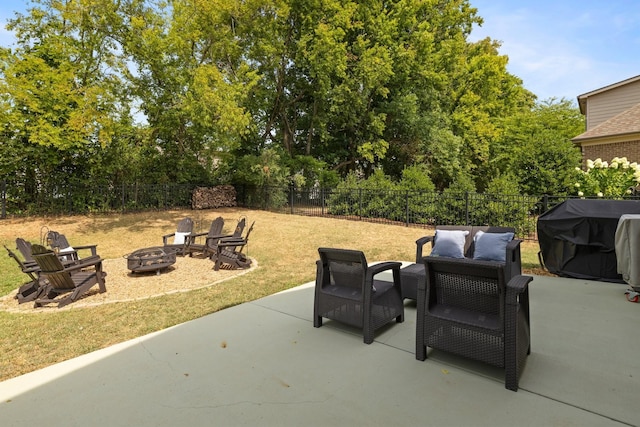 view of patio / terrace featuring an outdoor fire pit, grilling area, and a fenced backyard