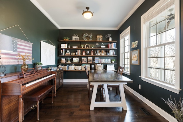 office space with ornamental molding, dark wood-style flooring, visible vents, and baseboards