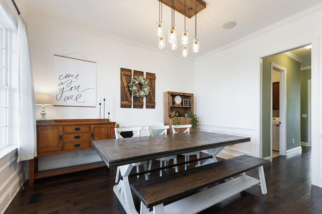 dining room with dark wood-style floors, visible vents, crown molding, and baseboards